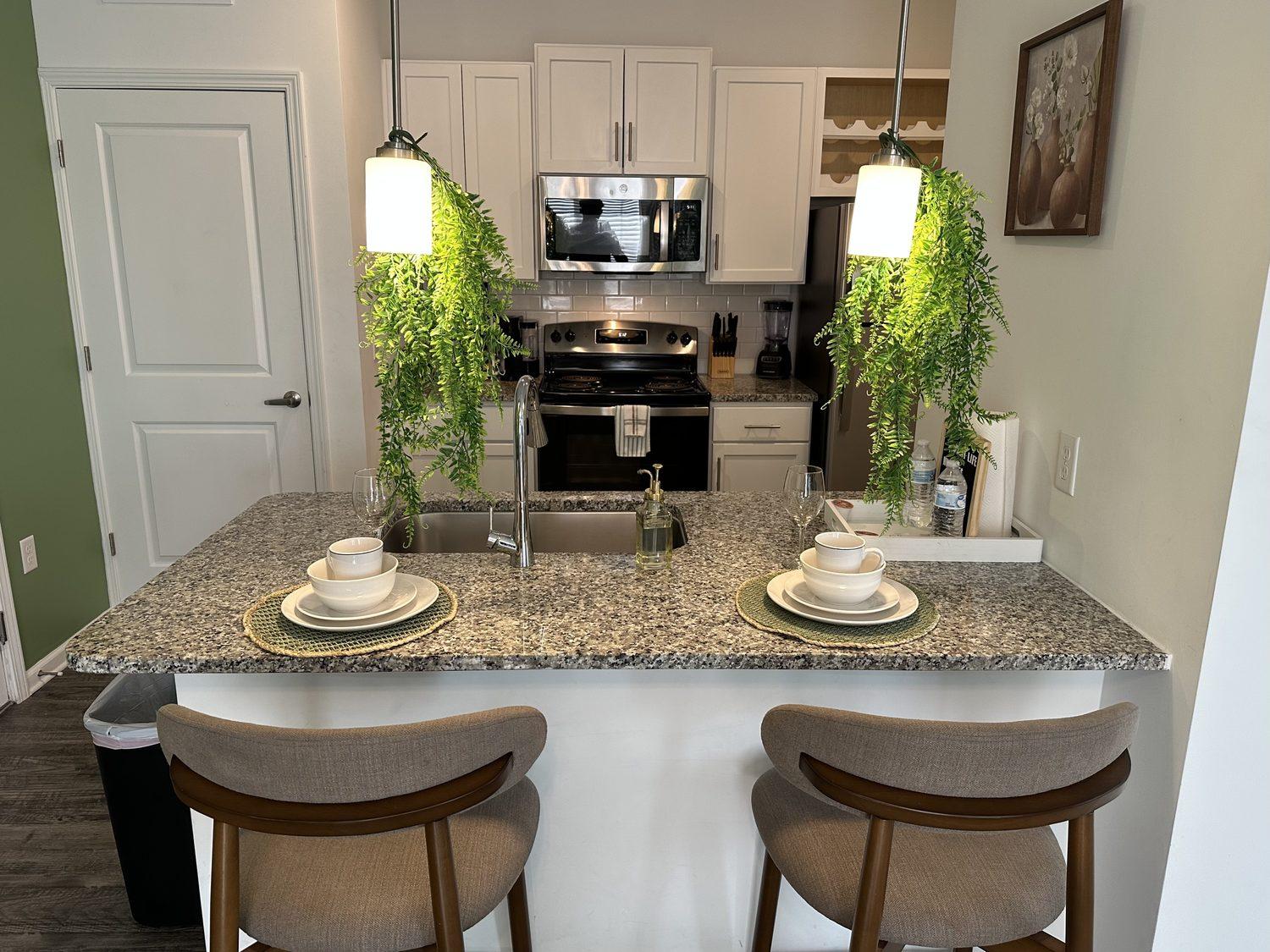 Dining area, post-turn, 1:07 PM — dining table reset and wiped down